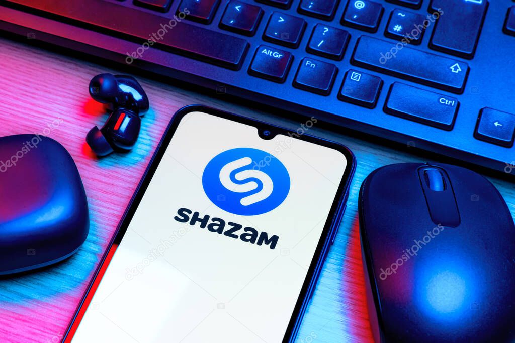 Prague, Czechia - 10 21 2024: Smartphone on surface showing Shazam logo.