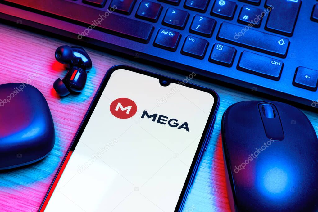 Prague, Czechia - 10 21 2024: Smartphone on surface showing Mega logo.