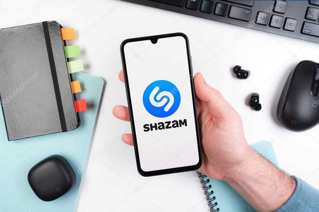 Prague, Czechia - 10 21 2024: Smartphone on surface showing Shazam logo.