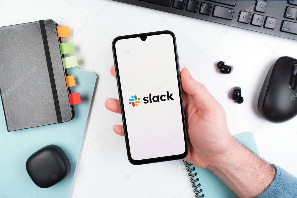Prague, Czechia - 10 21 2024: Smartphone on surface showing Slack logo.
