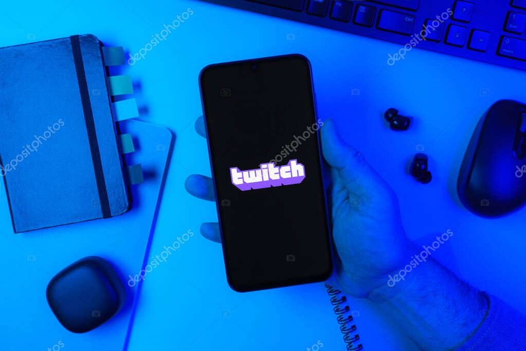 Prague, Czechia - 10 21 2024: Smartphone on surface showing Twitch logo.
