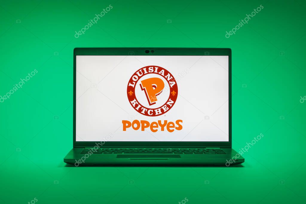Prague, Czechia - 02 21 2025: Laptop on surface showing Popeyes logo.