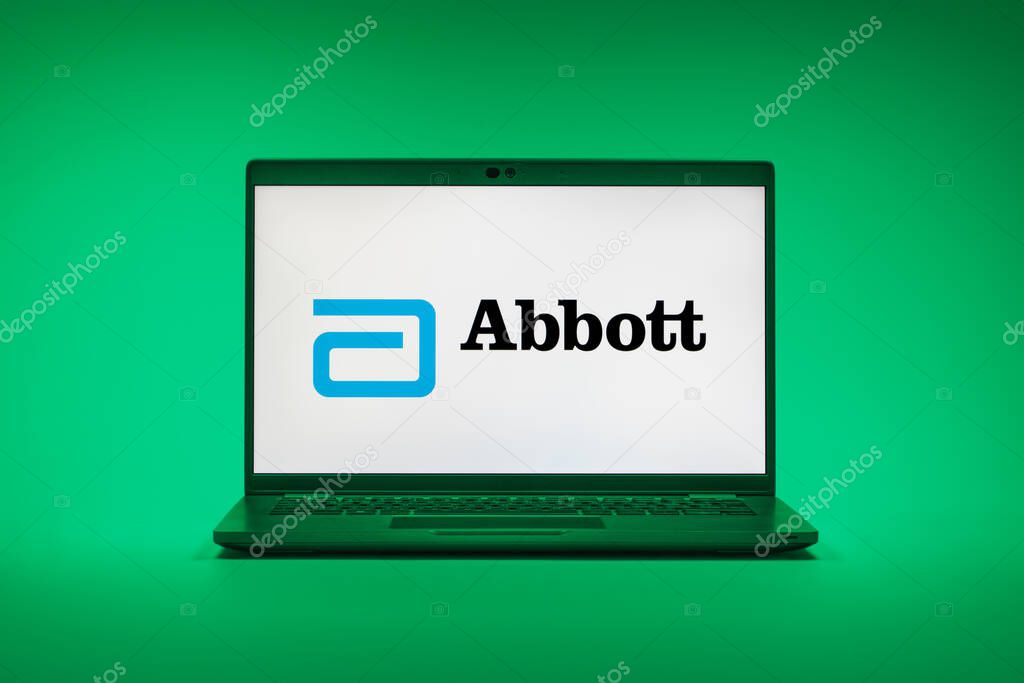 Prague, Czechia - 02 21 2025: Laptop on surface showing Abbott Laboratories logo.