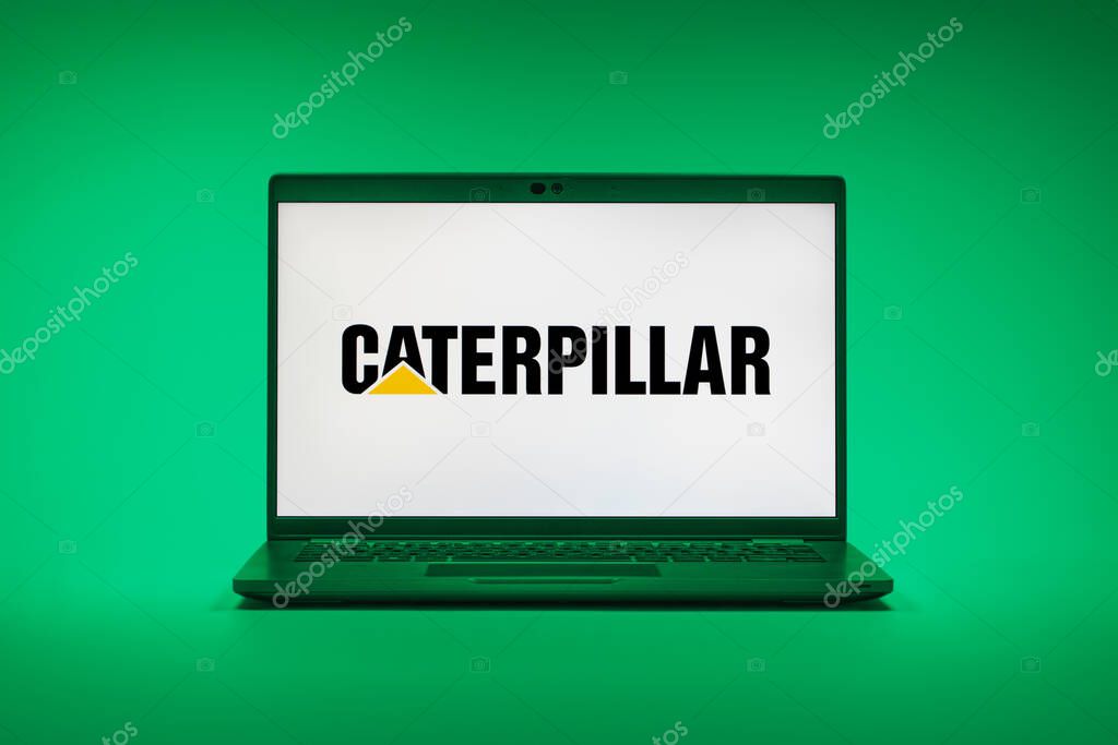 Prague, Czechia - 02 21 2025: Laptop on surface showing Caterpillar logo.