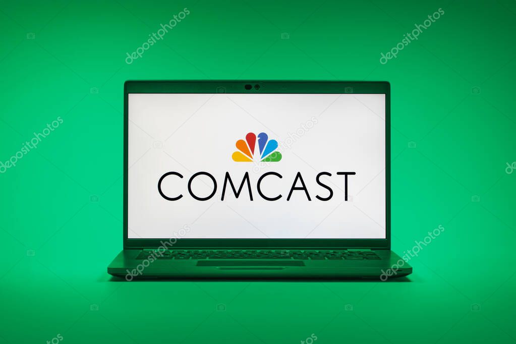 Prague, Czechia - 02 21 2025: Laptop on surface showing Comcast logo.