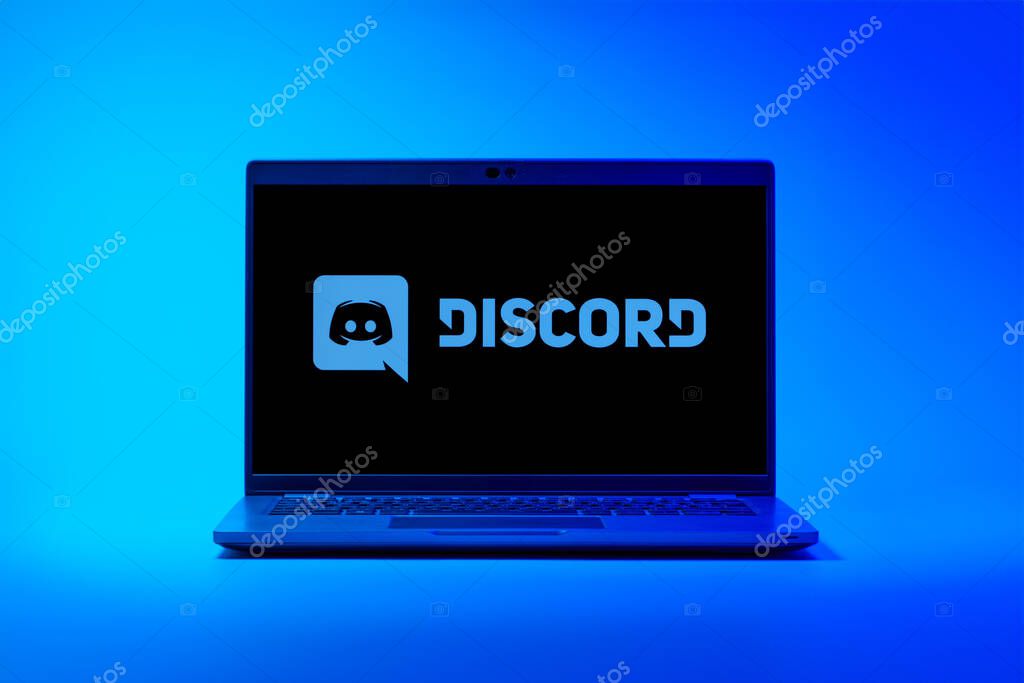 Prague, Czechia - 02 21 2025: Laptop on surface showing Discord logo.
