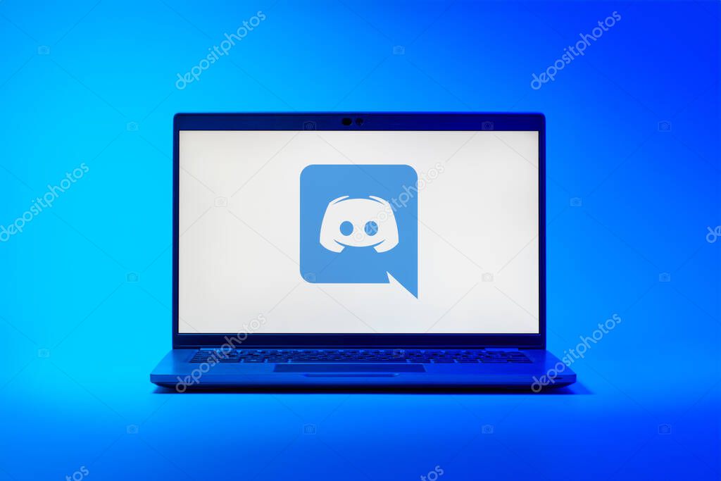 Prague, Czechia - 02 21 2025: Laptop on surface showing Discord logo.