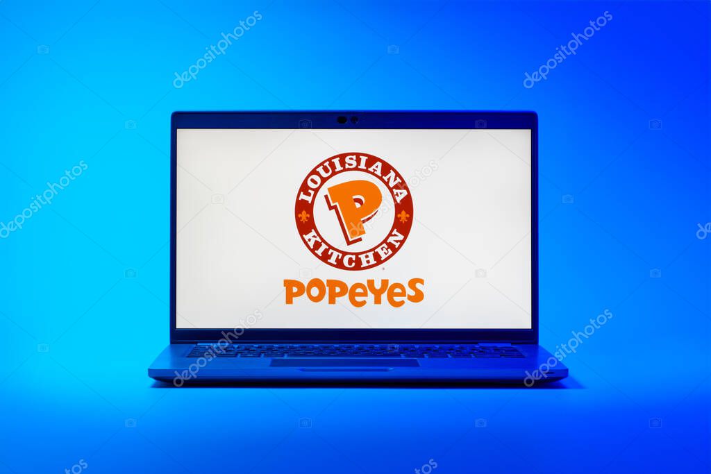 Prague, Czechia - 02 21 2025: Laptop on surface showing Popeyes logo.
