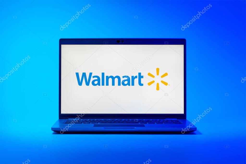 Prague, Czechia - 02 21 2025: Laptop on surface showing Walmart logo.