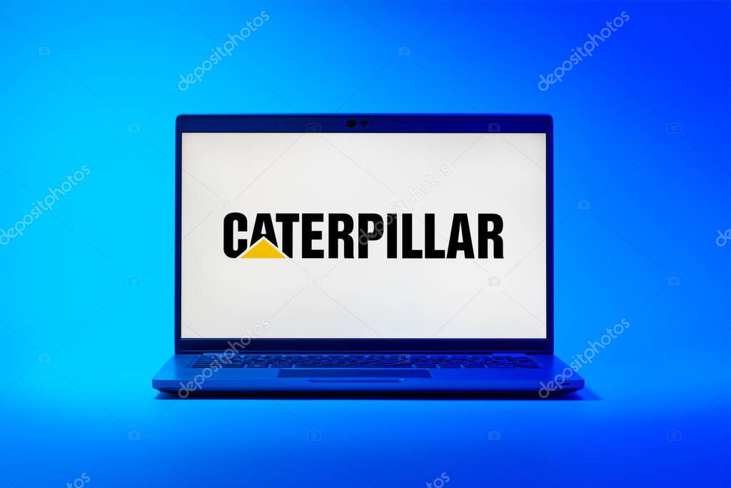 Prague, Czechia - 02 21 2025: Laptop on surface showing Caterpillar logo.