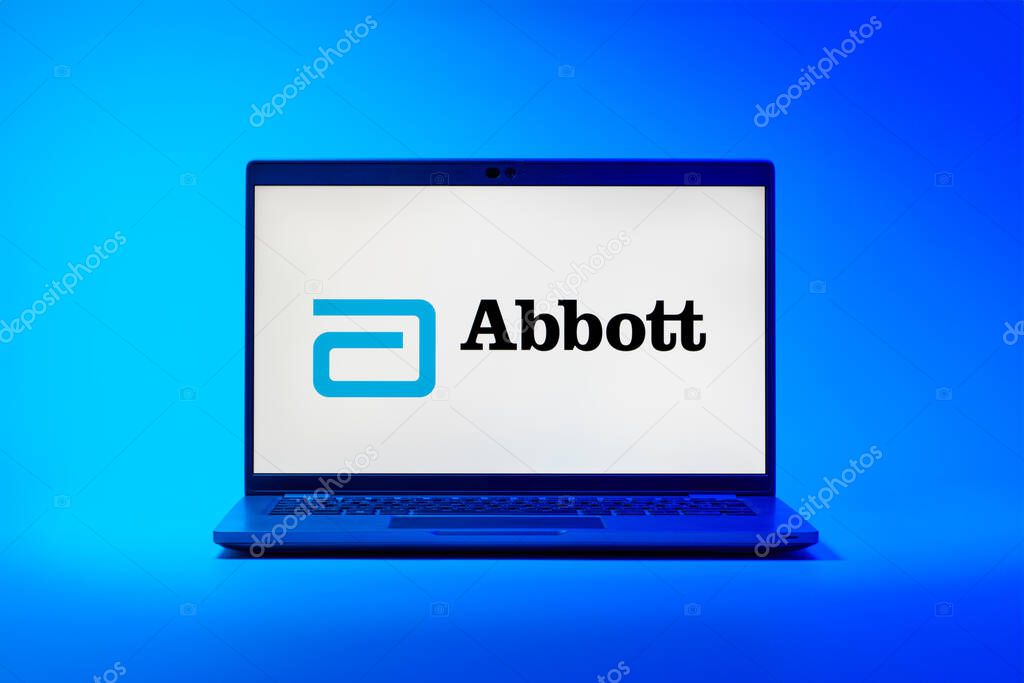 Prague, Czechia - 02 21 2025: Laptop on surface showing Abbott Laboratories logo.