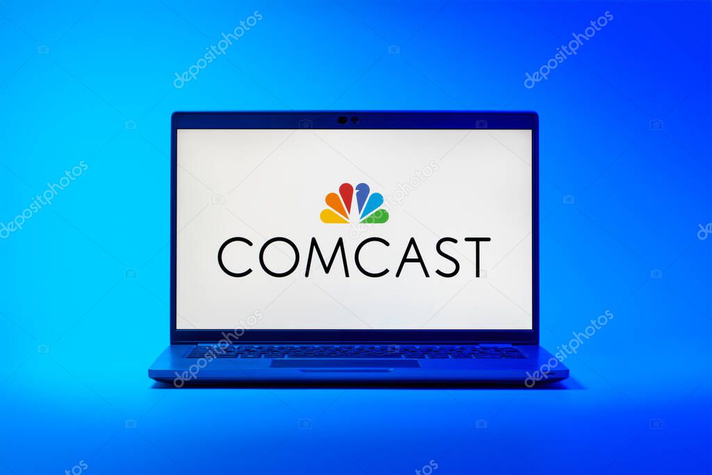 Prague, Czechia - 02 21 2025: Laptop on surface showing Comcast logo.