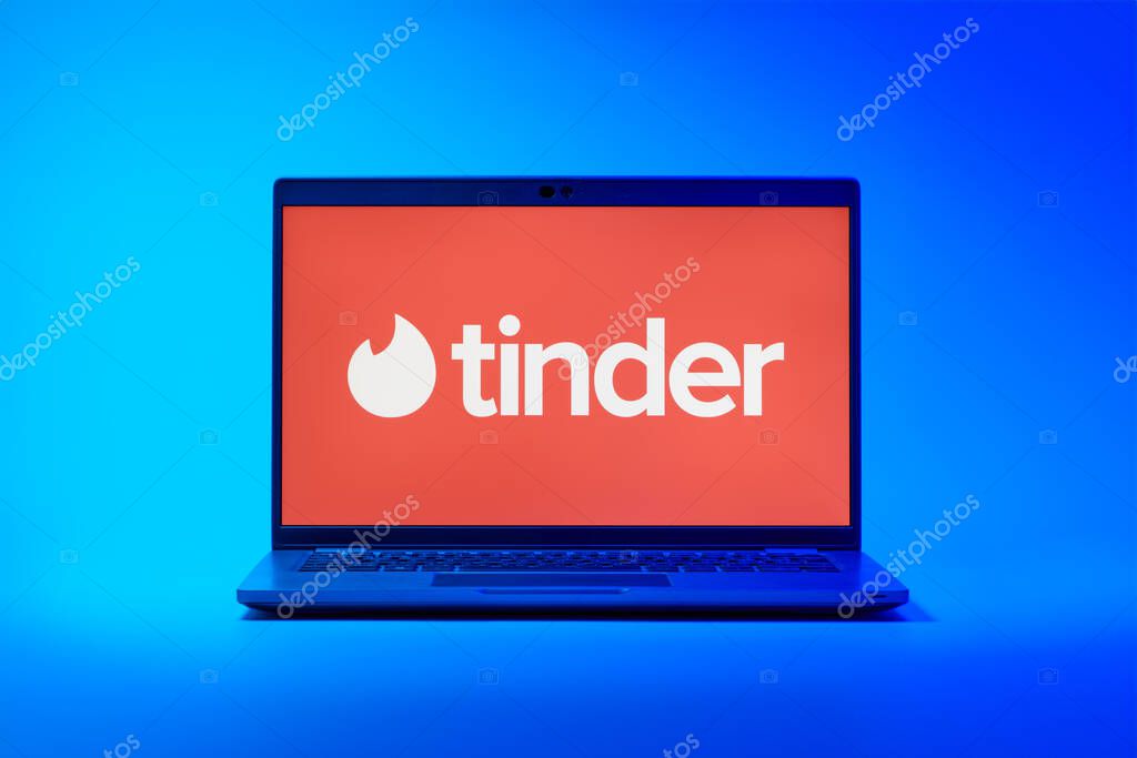 Prague, Czechia - 02 21 2025: Laptop on surface showing Tinder logo.