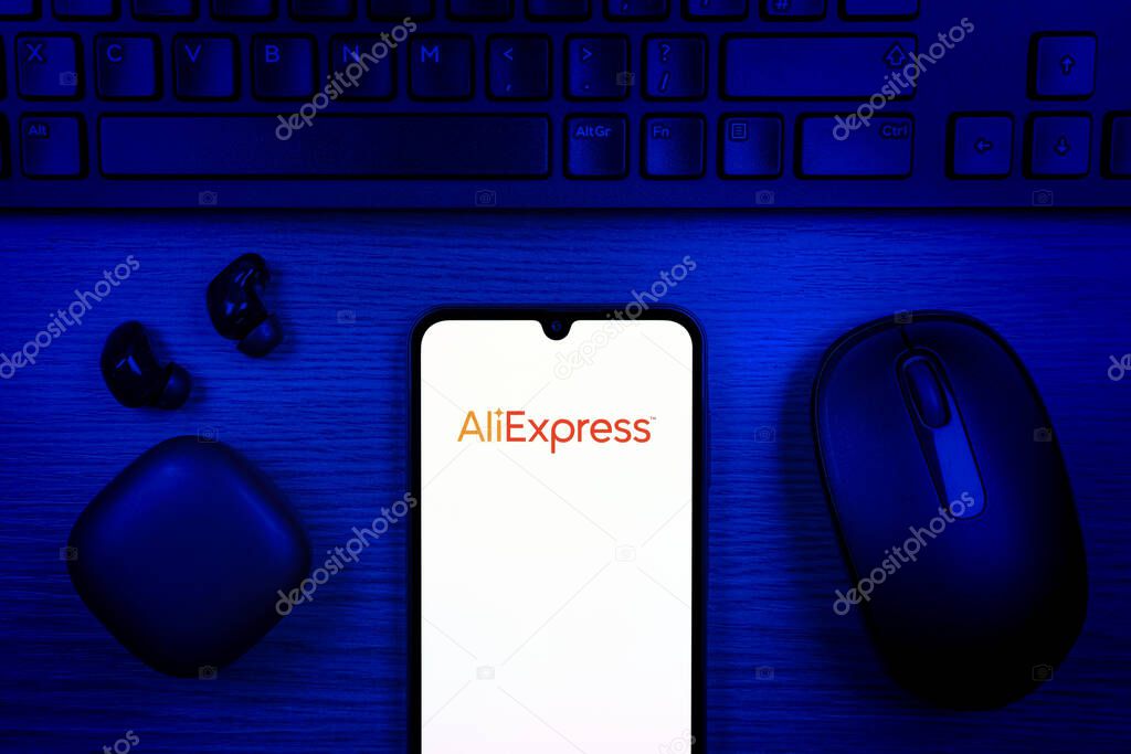 Prague, Czechia - 10 21 2024: Smartphone on surface showing AliExpress logo.