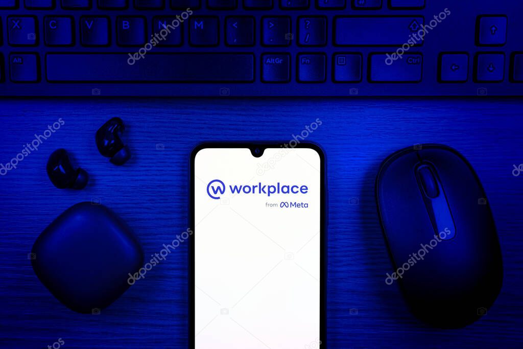 Prague, Czechia - 10 21 2024: Smartphone on surface showing Workplace logo.