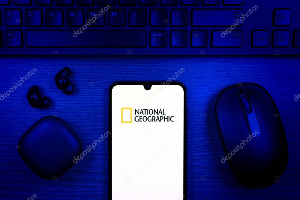 Prague, Czechia - 10 21 2024: Smartphone on surface showing National Geographic logo.