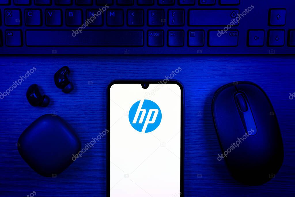 Prague, Czechia - 10 21 2024: Smartphone on surface showing Hewlett-Packard logo.