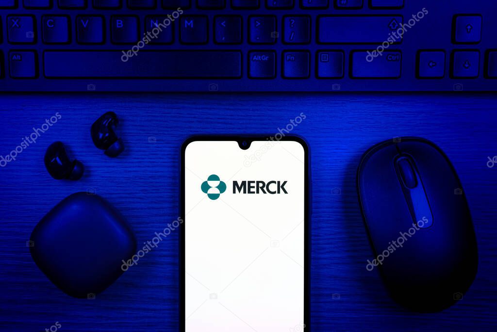 Prague, Czechia - 10 21 2024: Smartphone on surface showing Merck logo.