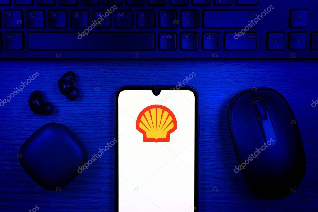 Prague, Czechia - 10 21 2024: Smartphone on surface showing Shell logo.