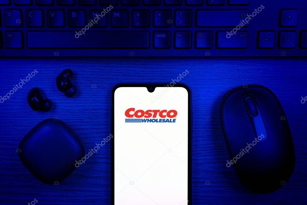 Prague, Czechia - 10 21 2024: Smartphone on surface showing Costco logo.
