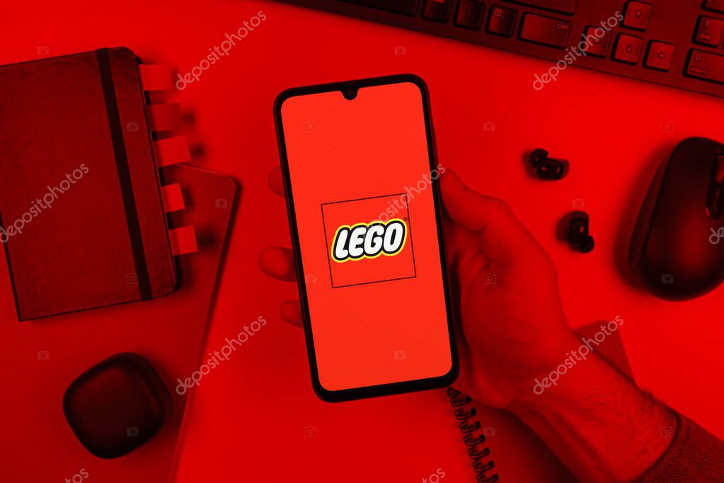 Prague, Czechia - 10 21 2024: Smartphone on surface showing Lego logo.