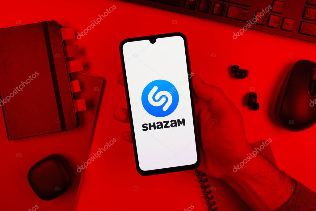 Prague, Czechia - 10 21 2024: Smartphone on surface showing Shazam logo.