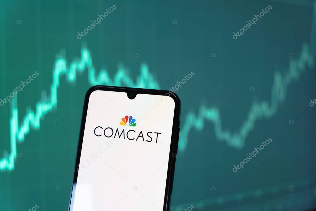Prague, Czechia - 10 21 2024: Smartphone on surface showing Comcast logo.