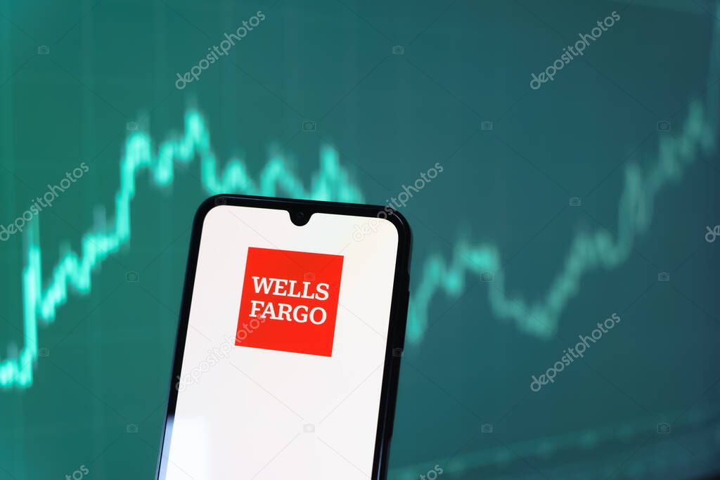 Prague, Czechia - 10 21 2024: Smartphone on surface showing Wells Fargo logo.