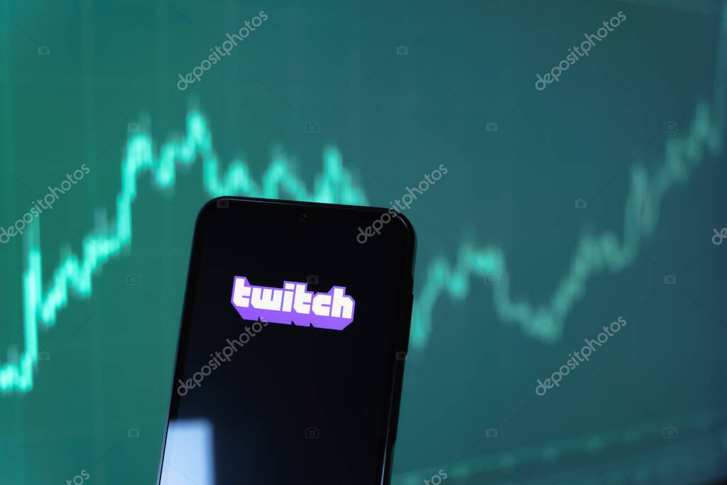 Prague, Czechia - 10 21 2024: Smartphone on surface showing Twitch logo.