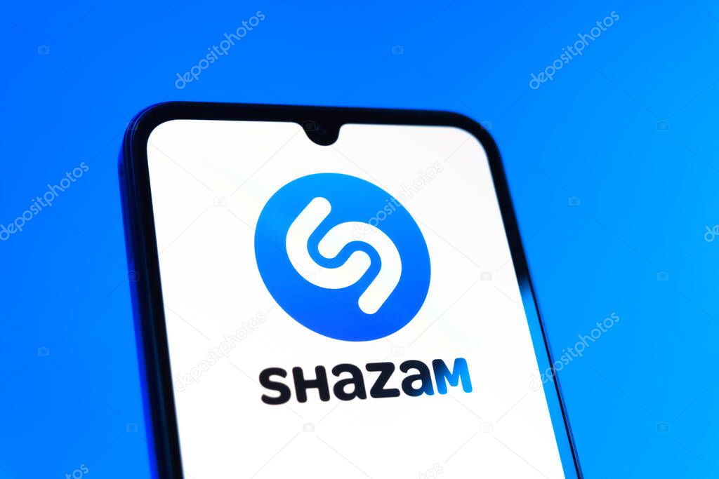 Prague, Czechia - 10 21 2024: Smartphone on surface showing Shazam logo.