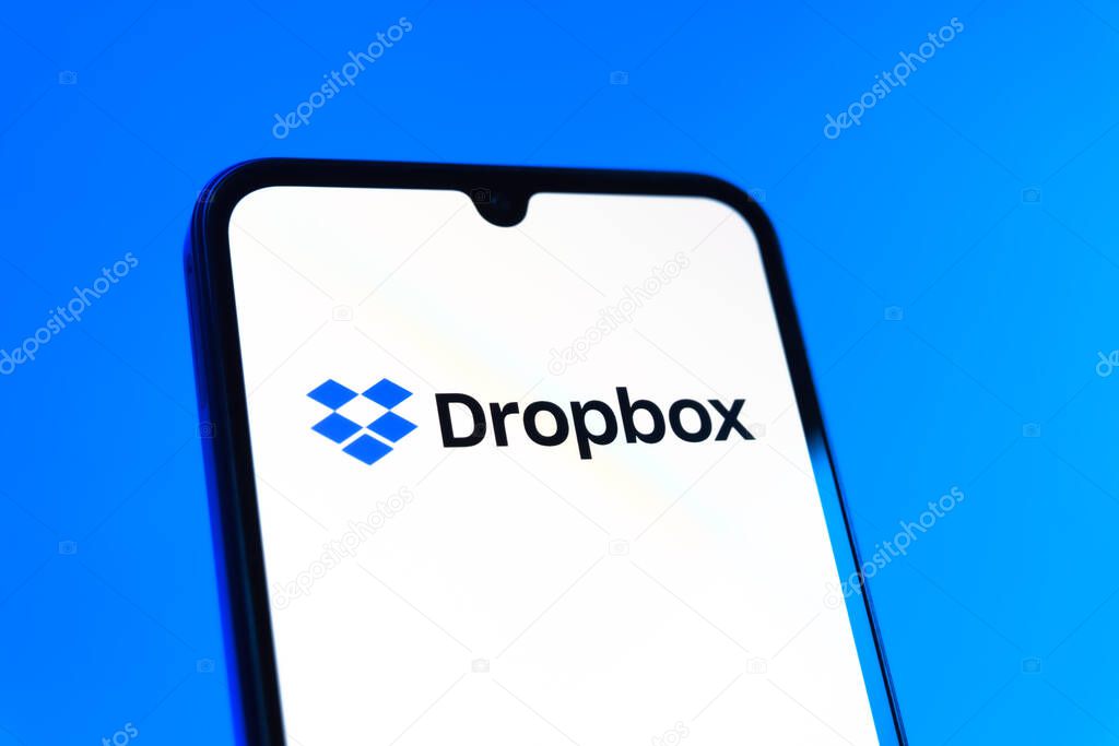 Prague, Czechia - 10 21 2024: Smartphone on surface showing Dropbox logo.