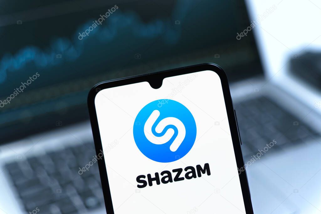 Prague, Czechia - 05 08 2025: Smartphone on surface showing Shazam logo.