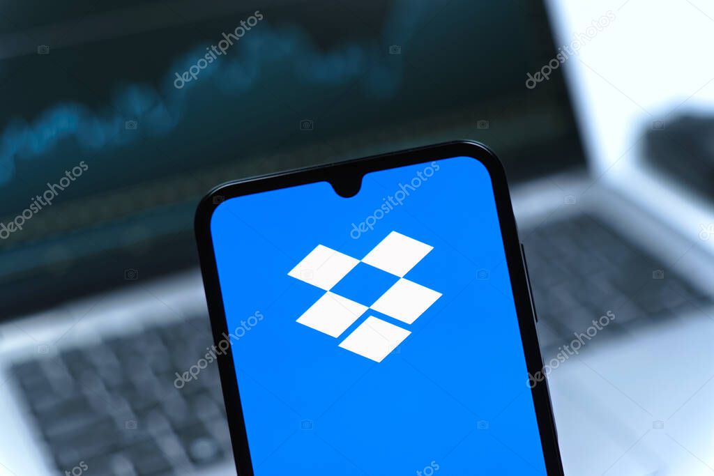 Prague, Czechia - 05 08 2025: Smartphone on surface showing Dropbox logo.