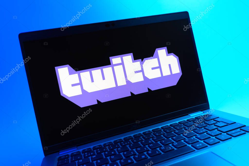 Prague, Czechia - 05 08 2025: A close-up view of a laptop lying on a colorful background, showing Twitch logo.