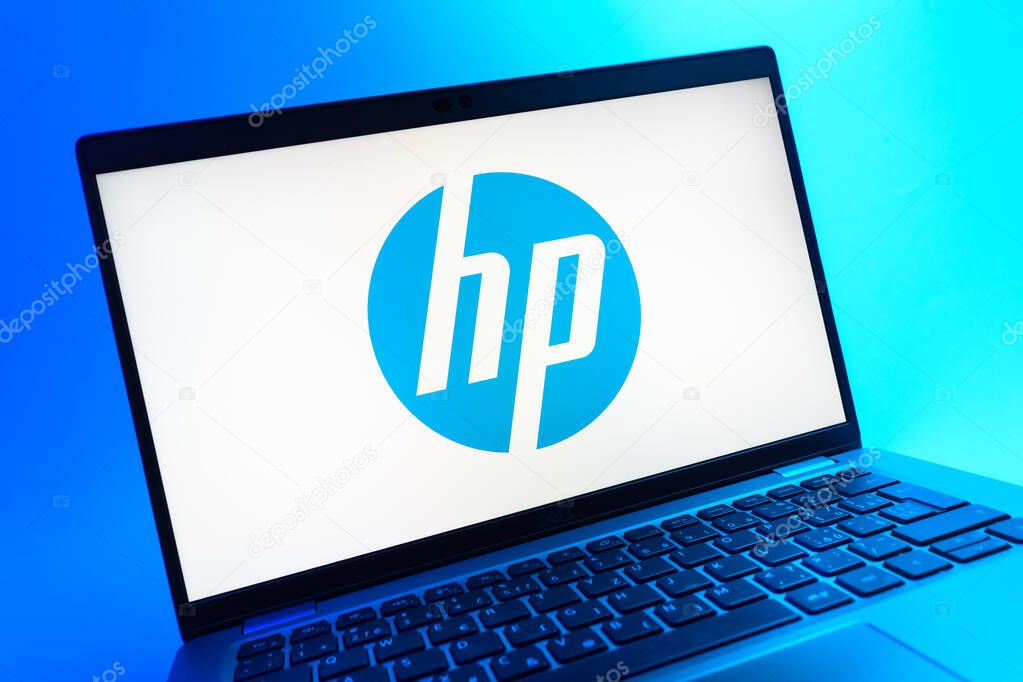 Prague, Czechia - 05 08 2025: A close-up view of a laptop lying on a colorful background, showing Hewlett-Packard logo.