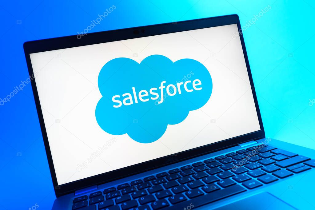 Prague, Czechia - 05 08 2025: A close-up view of a laptop lying on a colorful background, showing Salesforce logo.