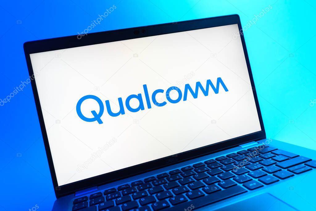 Prague, Czechia - 05 08 2025: A close-up view of a laptop lying on a colorful background, showing Qualcomm logo.
