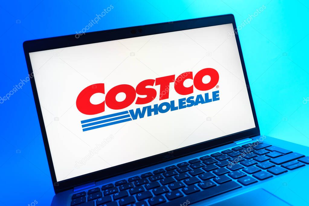 Prague, Czechia - 05 08 2025: A close-up view of a laptop lying on a colorful background, showing Costco logo.
