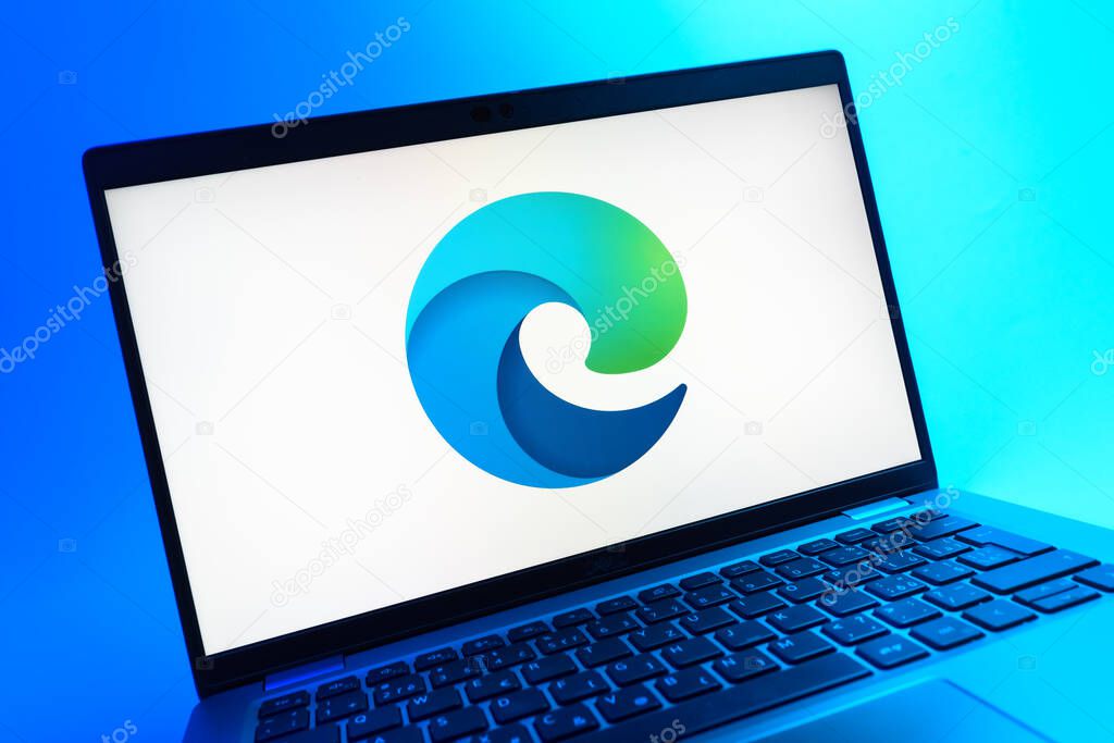 Prague, Czechia - 05 08 2025: A close-up view of a laptop lying on a colorful background, showing Edge logo.