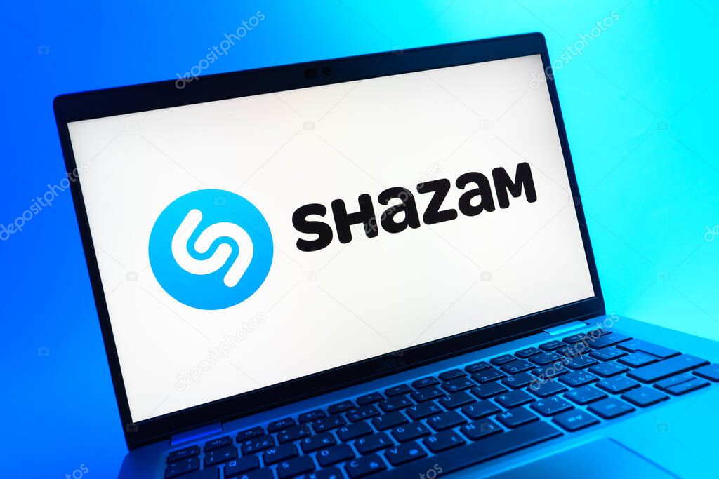 Prague, Czechia - 05 08 2025: A close-up view of a laptop lying on a colorful background, showing Shazam logo.