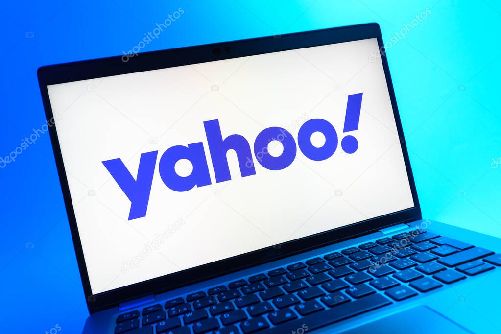 Prague, Czechia - 05 08 2025: A close-up view of a laptop lying on a colorful background, showing Yahoo logo.