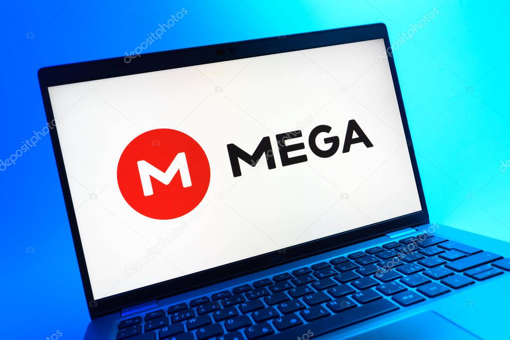 Prague, Czechia - 05 08 2025: A close-up view of a laptop lying on a colorful background, showing Mega logo.