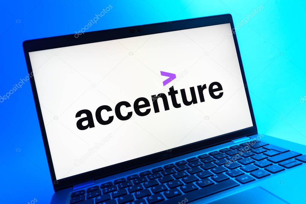 Prague, Czechia - 05 08 2025: A close-up view of a laptop lying on a colorful background, showing Accenture logo.