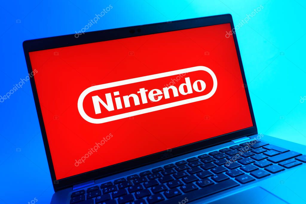Prague, Czechia - 05 08 2025: A close-up view of a laptop lying on a colorful background, showing Nintendo logo.