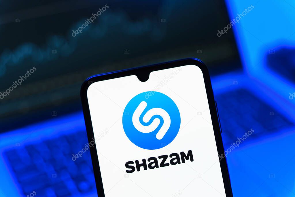 Prague, Czechia - 05 08 2025: Smartphone on surface showing Shazam logo.