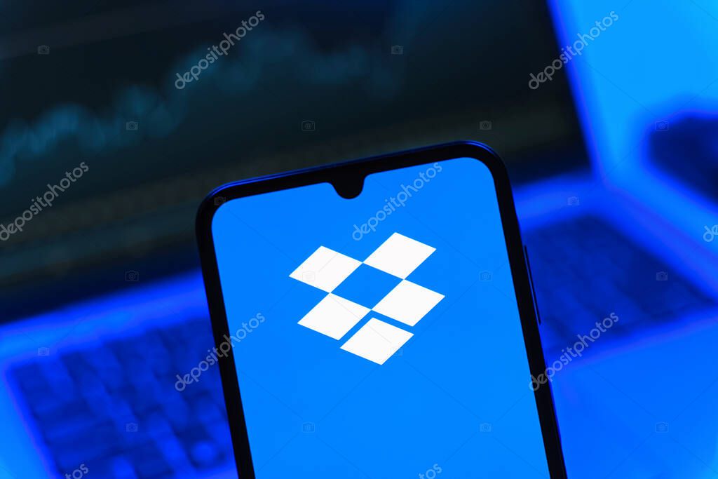 Prague, Czechia - 05 08 2025: Smartphone on surface showing Dropbox logo.