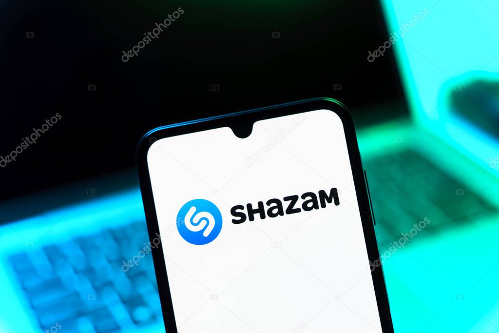 Prague, Czechia - 05 08 2025: Smartphone on surface showing Shazam logo.