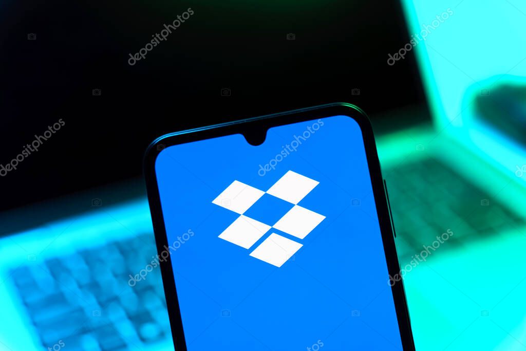 Prague, Czechia - 05 08 2025: Smartphone on surface showing Dropbox logo.