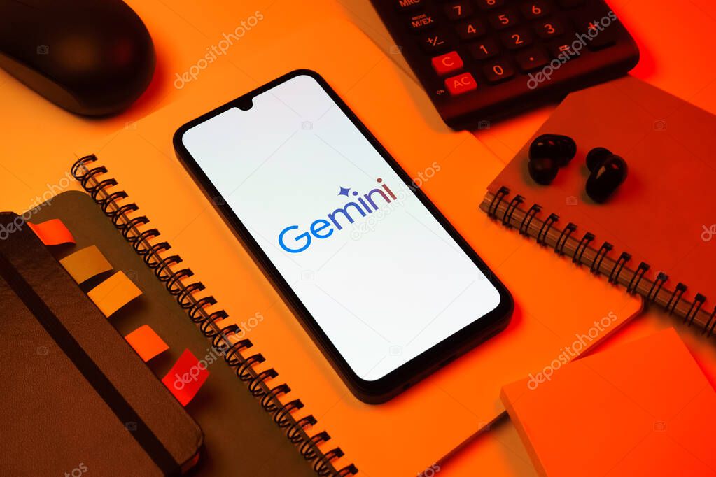 Prague, Czechia - 08 18 2025: An arrangement of office supplies with a mobile phone in the center displaying Gemini logo. Gemini is a platform for cryptocurrency trading and management.