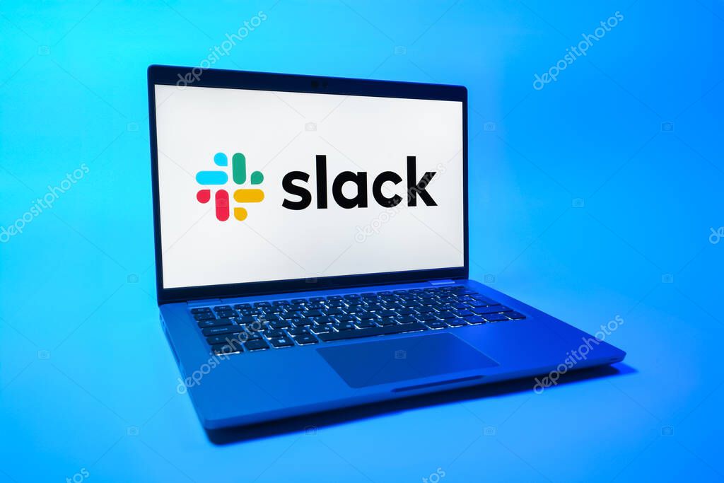 Prague, Czechia - 08 01 2025: A laptop on a uniform background displays the Slack logo. Slack is a platform for team messaging and workplace communication.